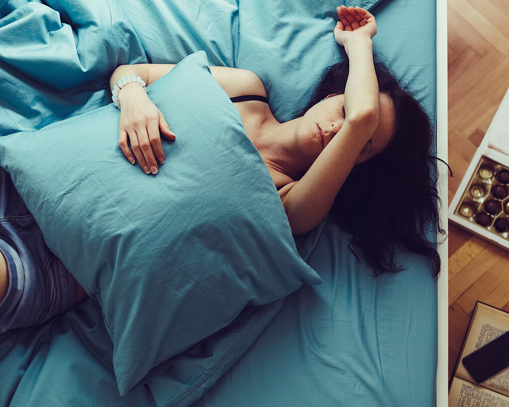 Sick woman sleeping at home