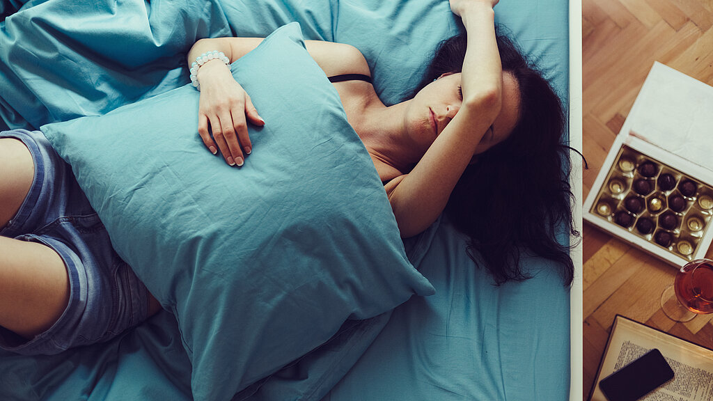 Sick woman sleeping at home
