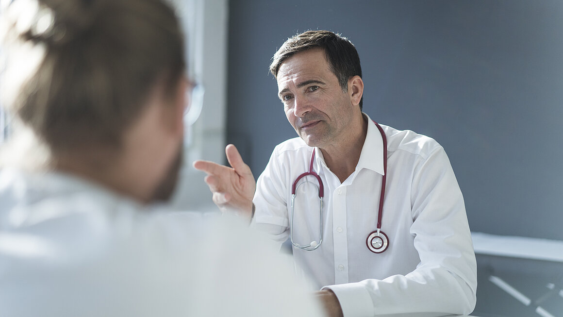 Doctor talking to patient in medical practice