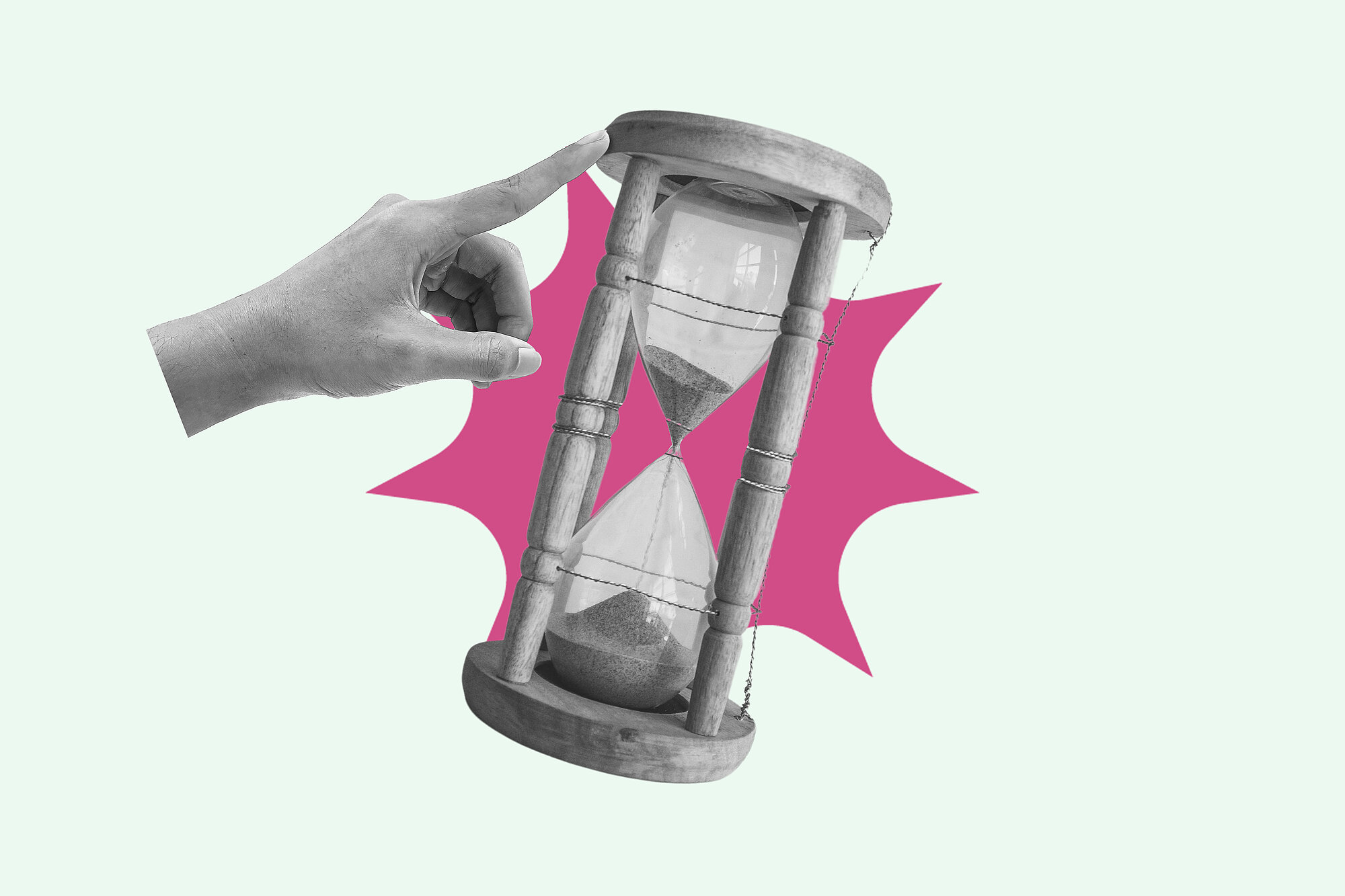 Hand pointing and pushing hourglass with sand falling, running out of time concept