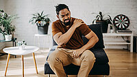 Middle aged man has shoulder pain. with copy space for text