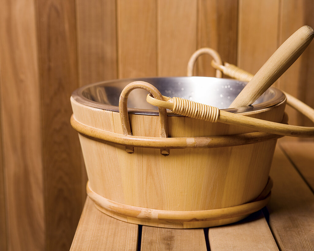 Wooden bucket in sauna