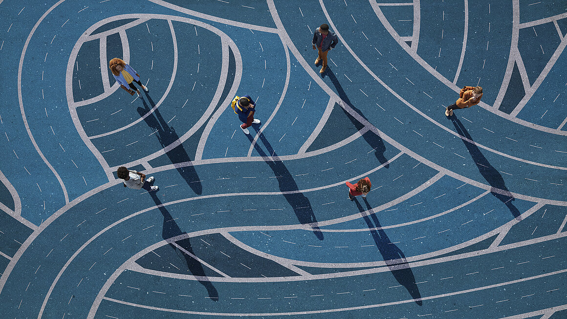 Group of people standing on different curvy roads, painted on asphalt