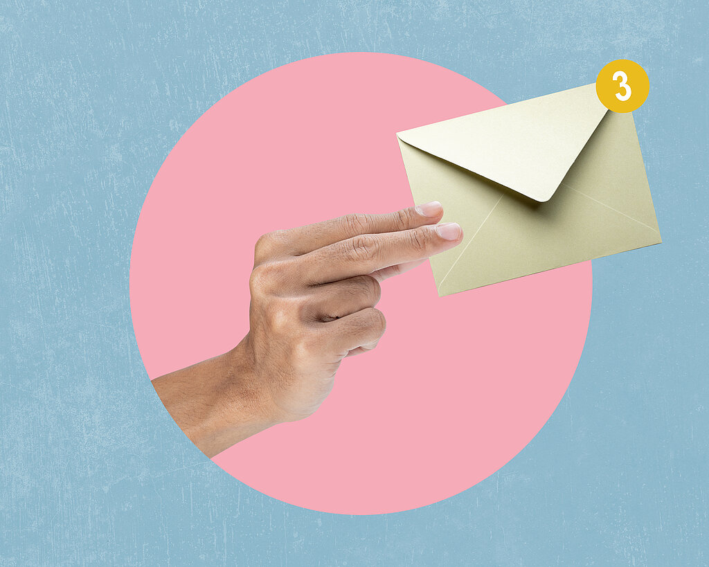Human hand holding envelope letter with a colored background